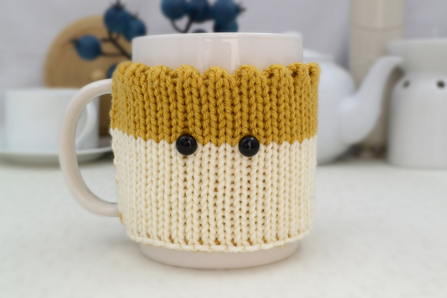 Knitted Mug Cozy with black eyes