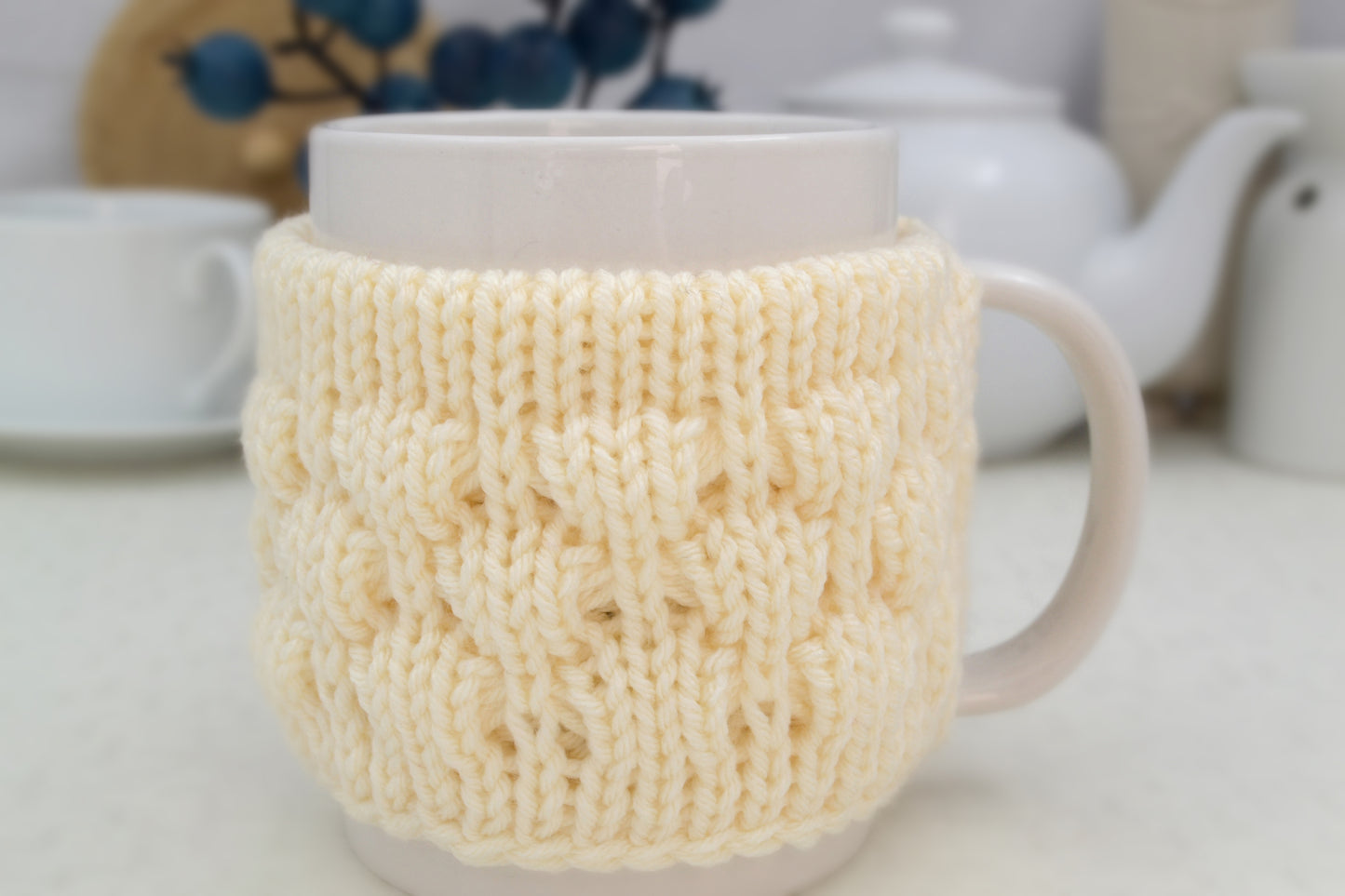 Knitted mug cozy.