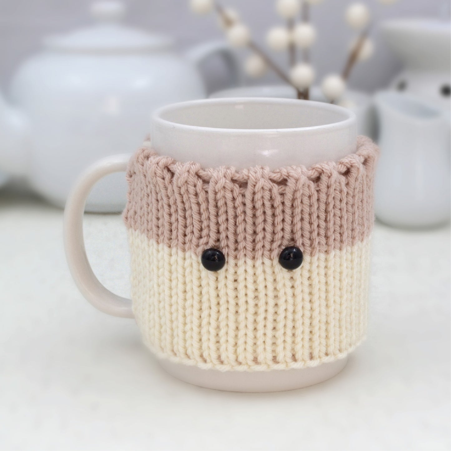 Knitted Mug Cozy with black eyes