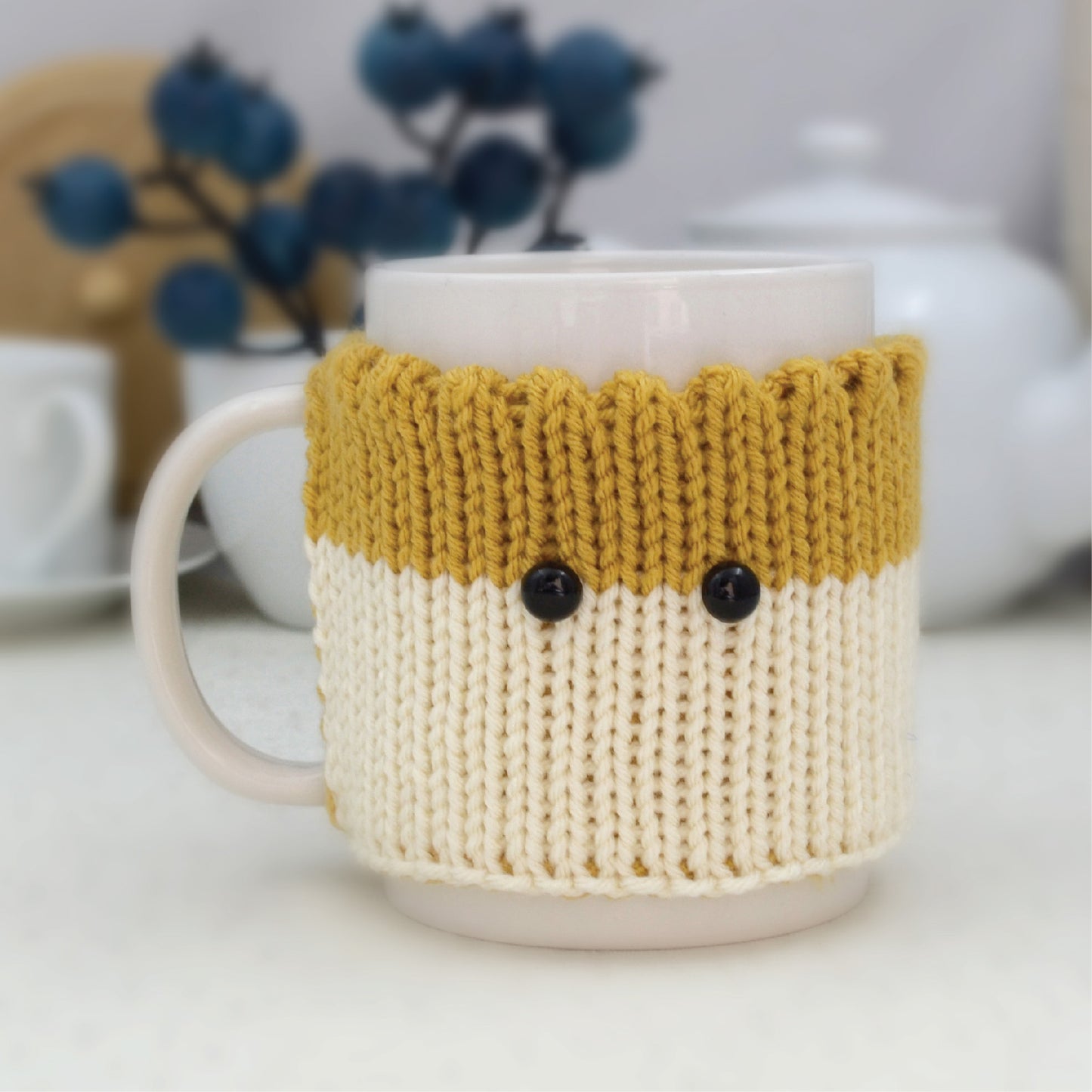 Knitted Mug Cozy with black eyes