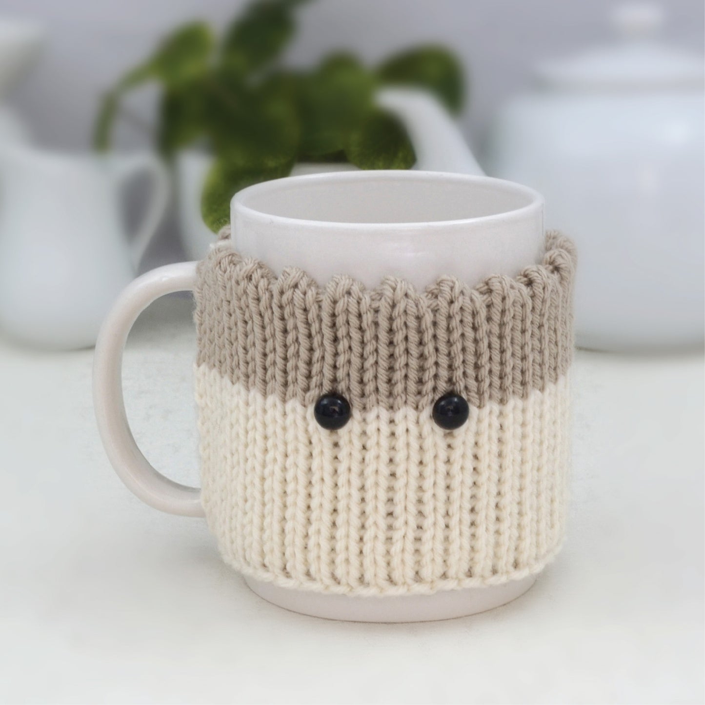 Knitted Mug Cozy with black eyes