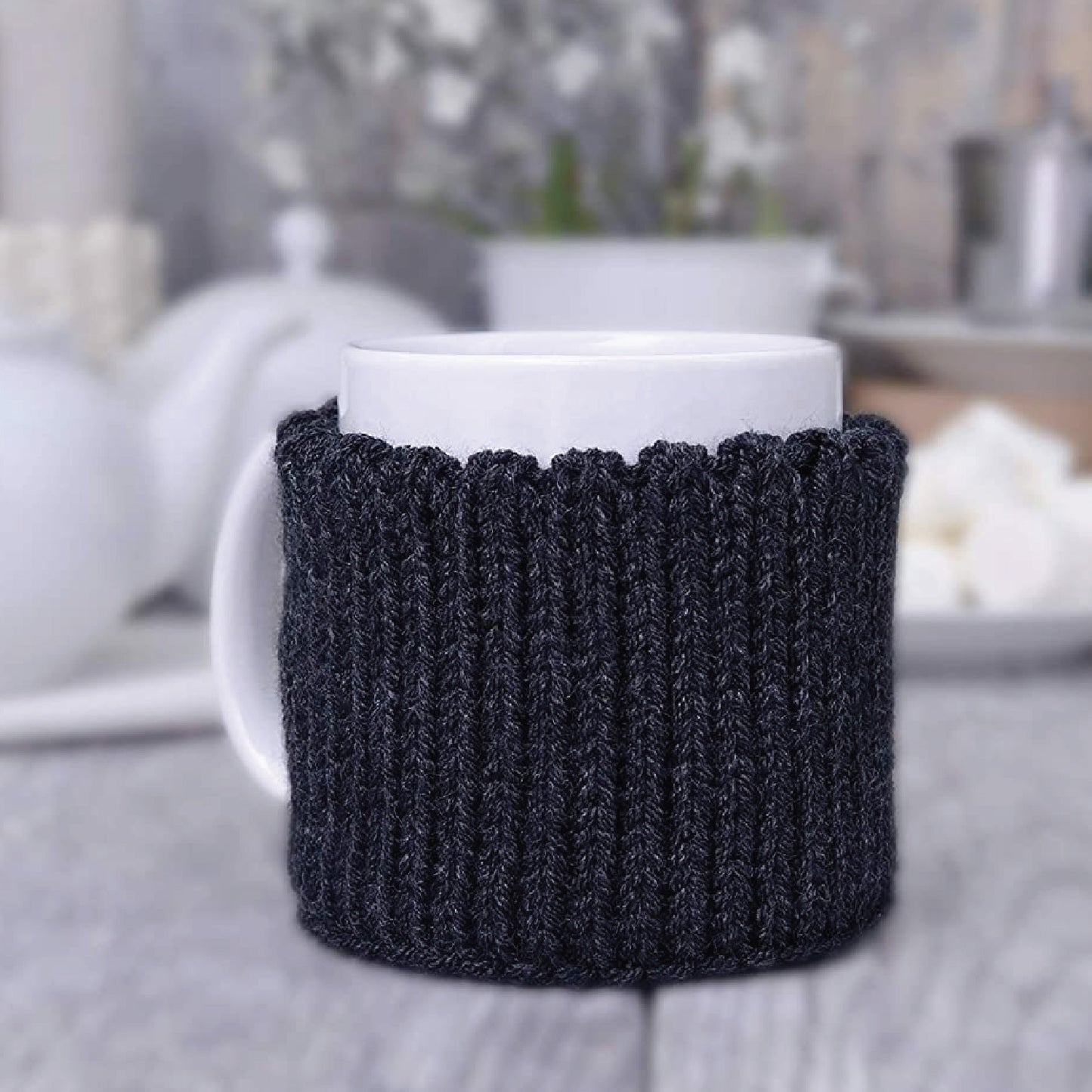 Dark gray knitted mug cozy