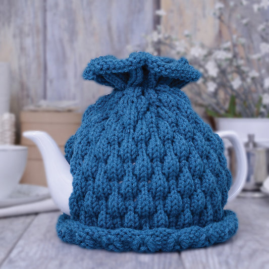 Teal knitted teapot cozy