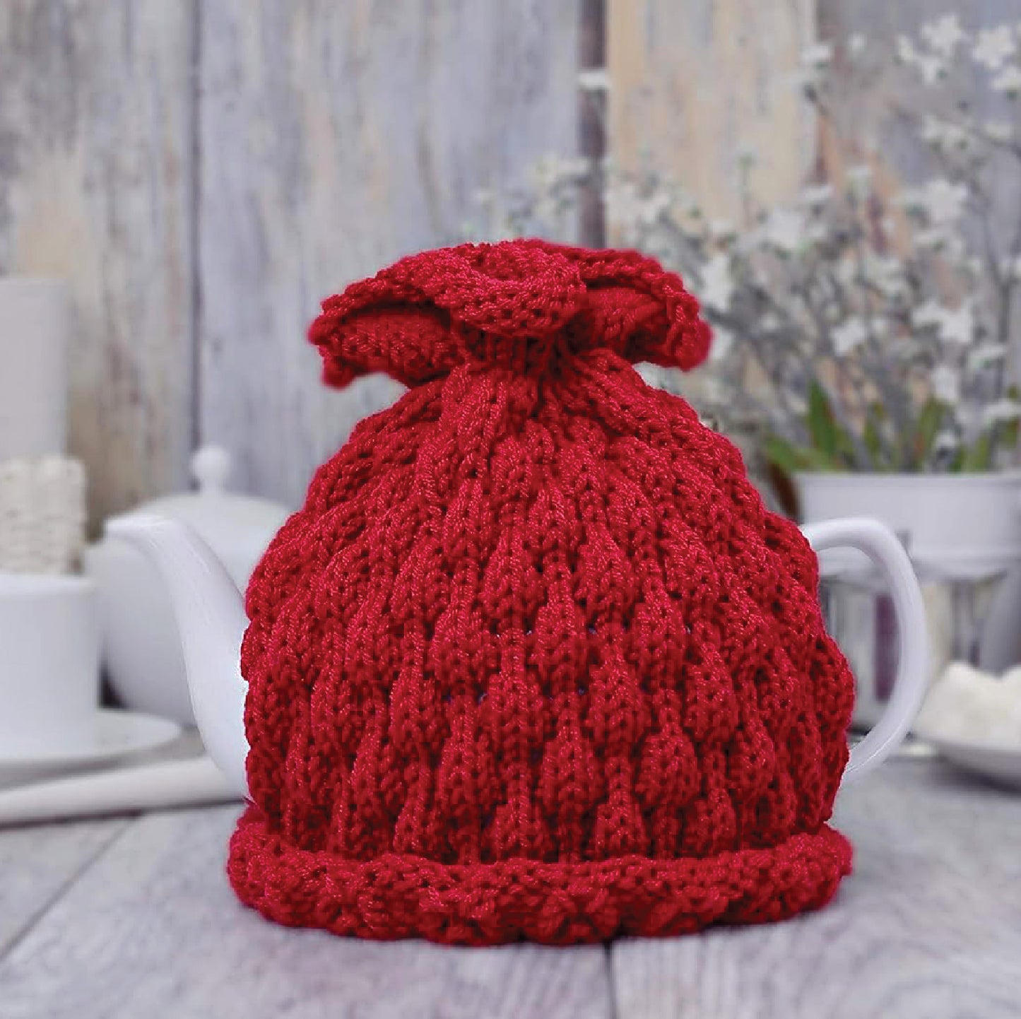 Red knitted teapot cozy