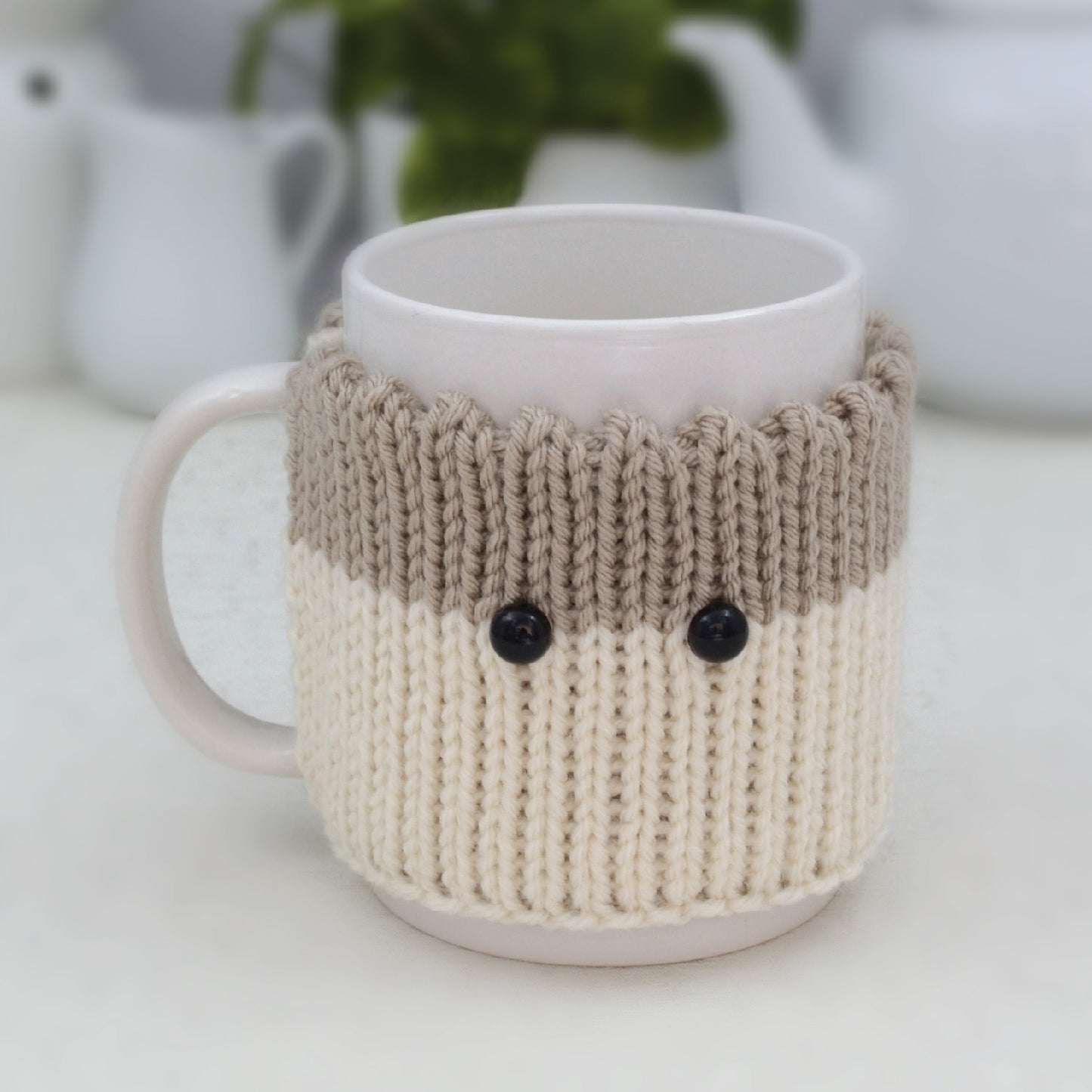 Knitted Mug Cozy with black eyes