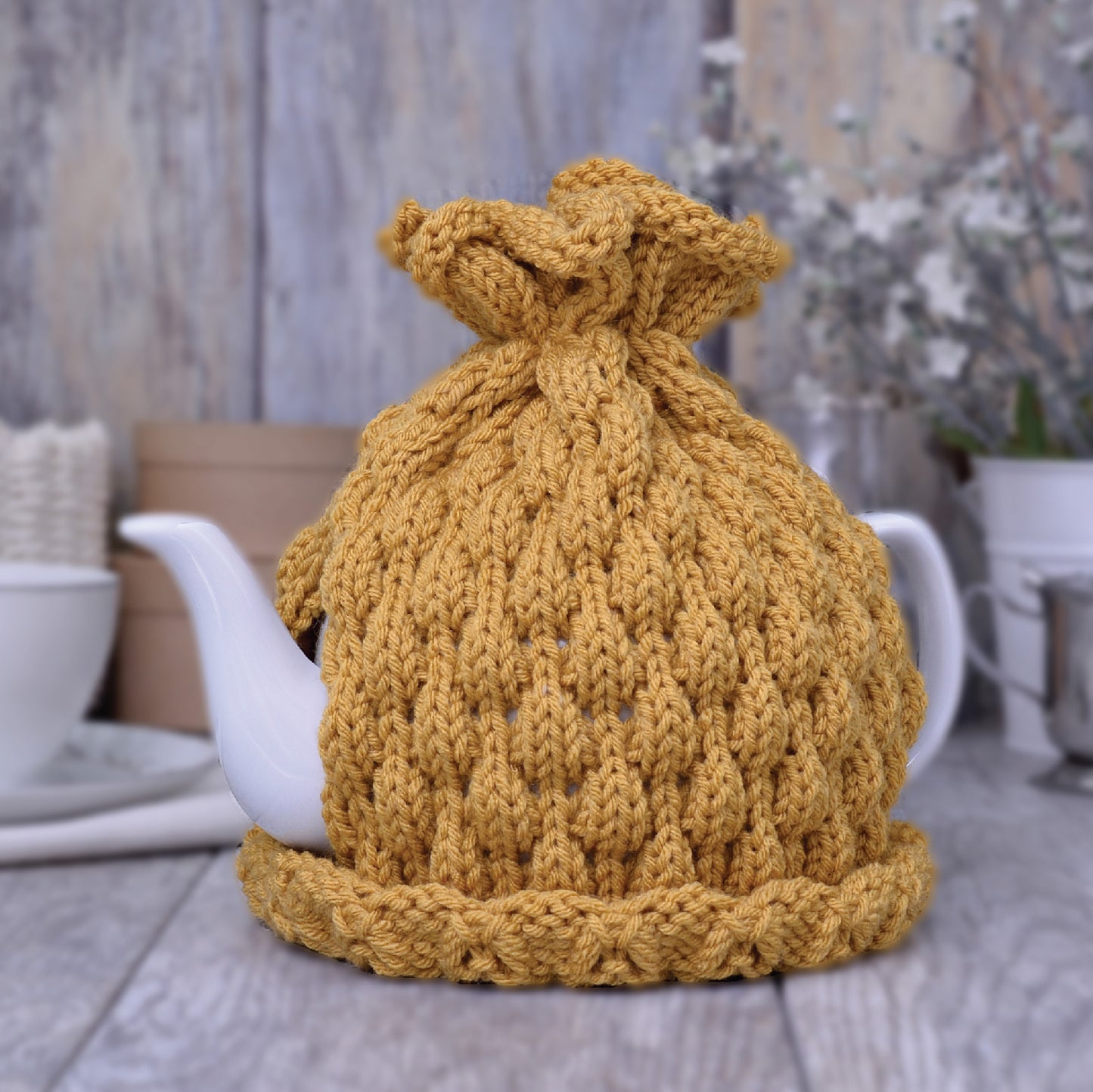 Mustard knitted teapot cozy