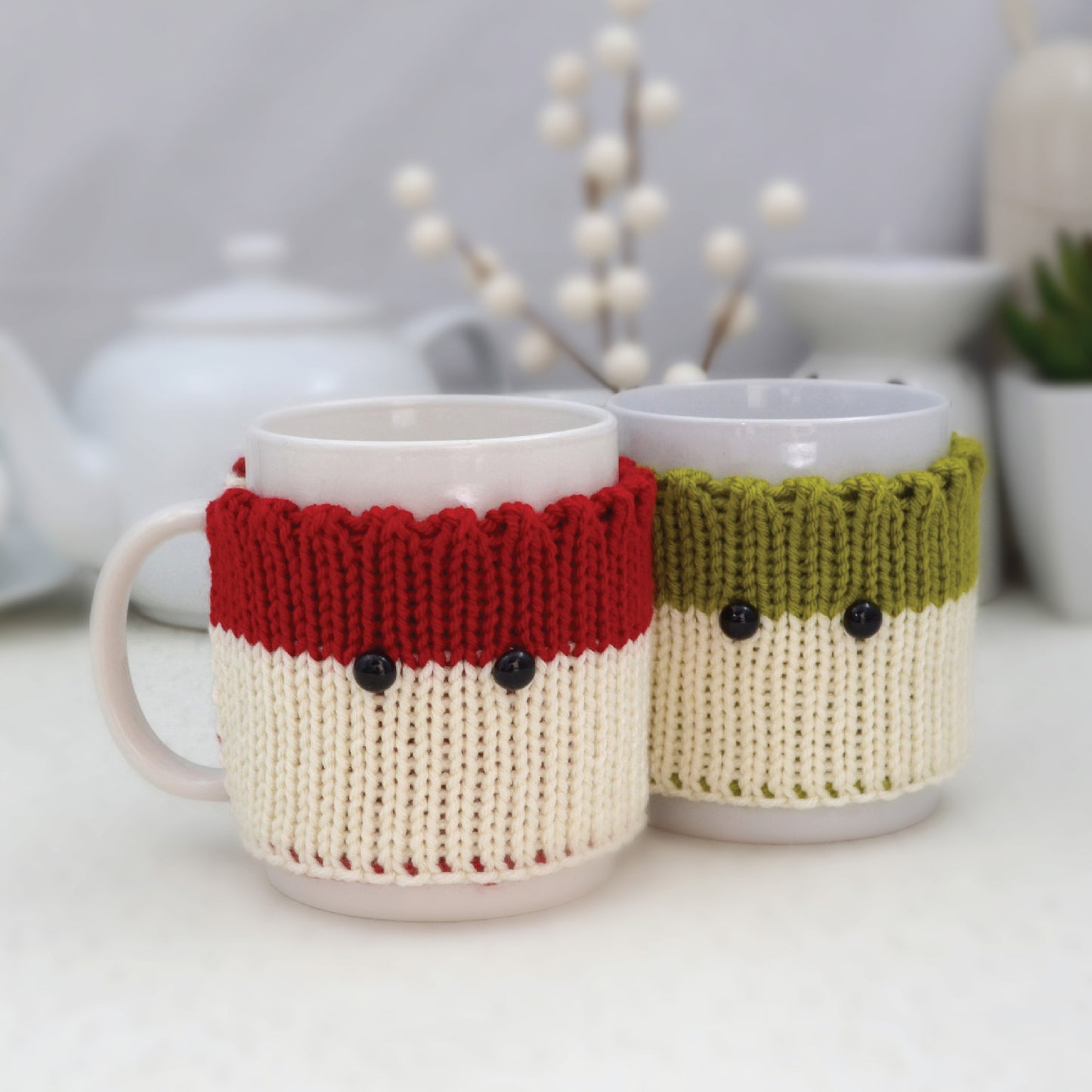 Knitted Mug Cozies with black eyes, Set of 2. Christmas gift.