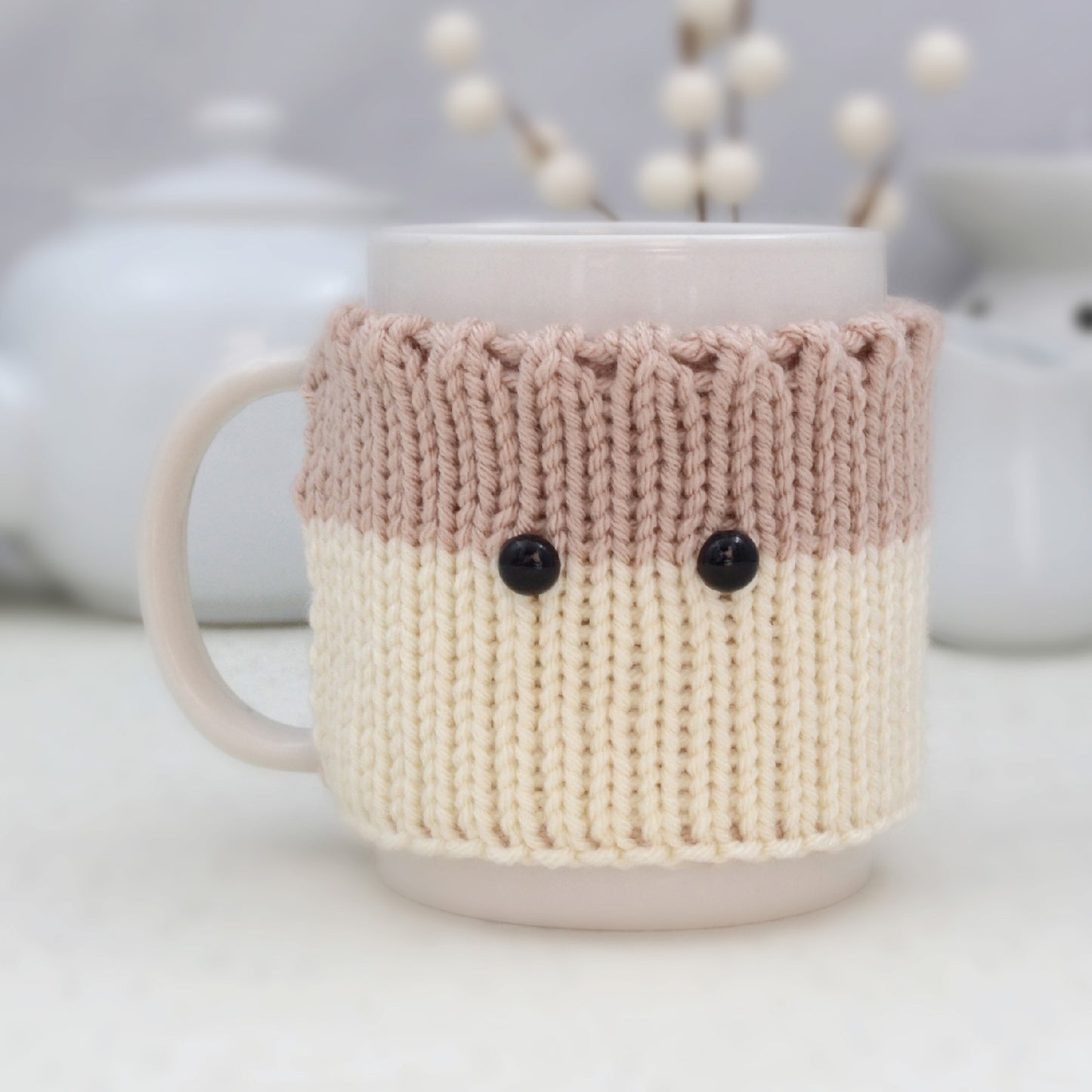 Knitted Mug Cozy with black eyes