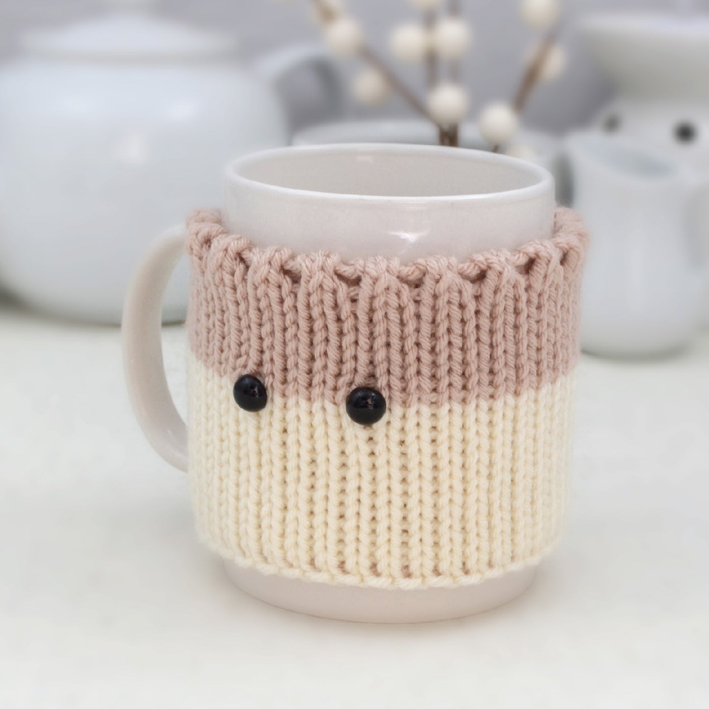 Knitted Mug Cozy with black eyes