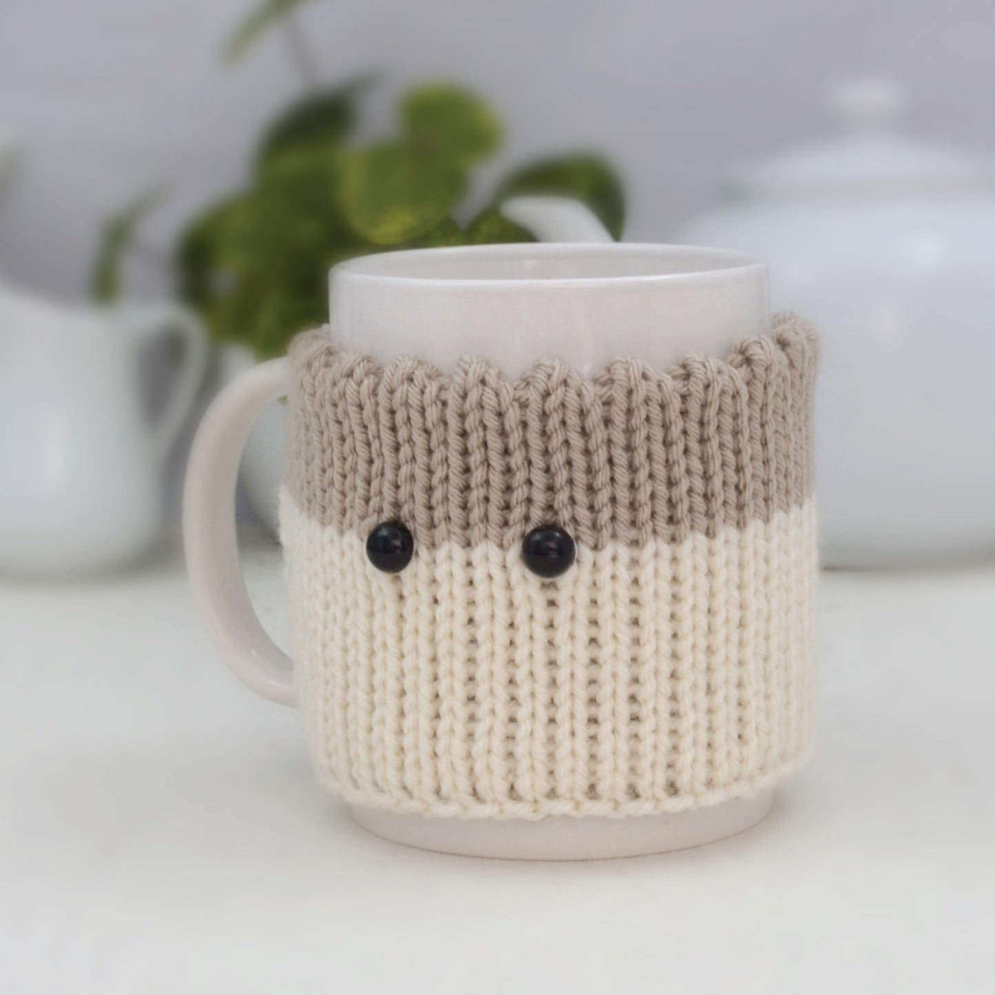 Knitted Mug Cozy with black eyes