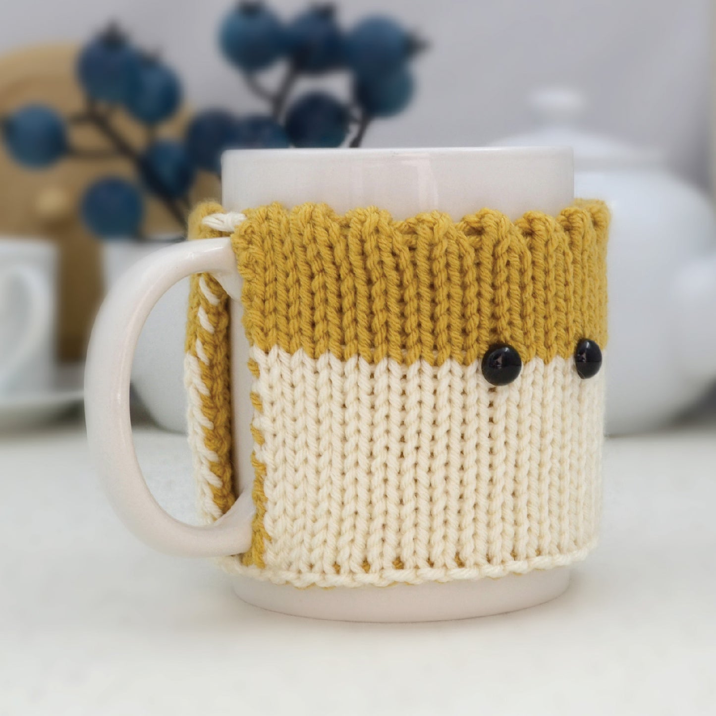 Knitted Mug Cozy with black eyes