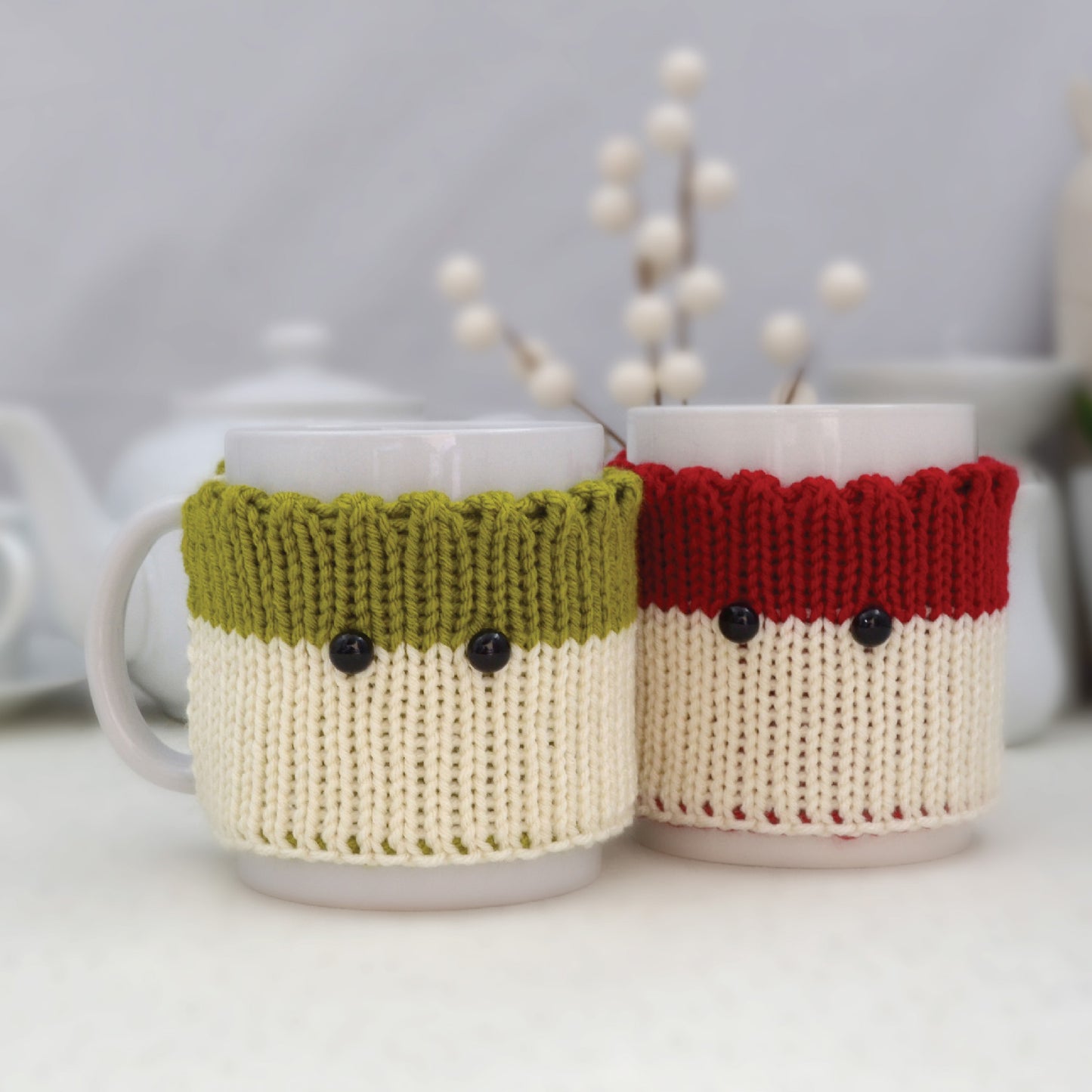 Knitted Mug Cozies with black eyes, Set of 2. Christmas gift.