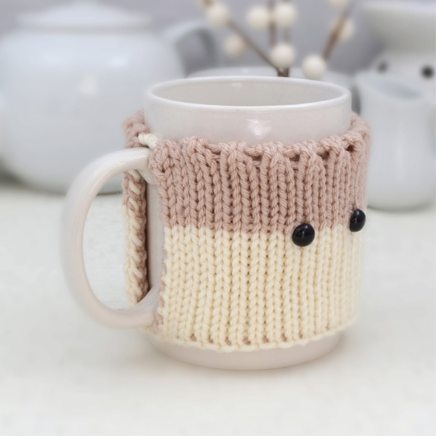 Knitted Mug Cozy with black eyes