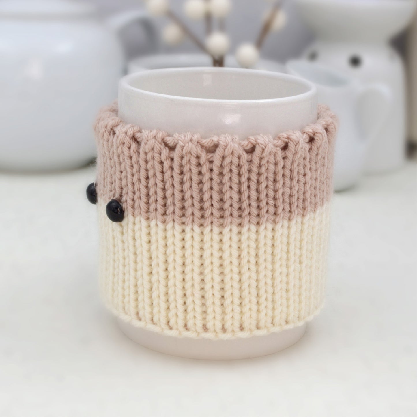 Knitted Mug Cozy with black eyes