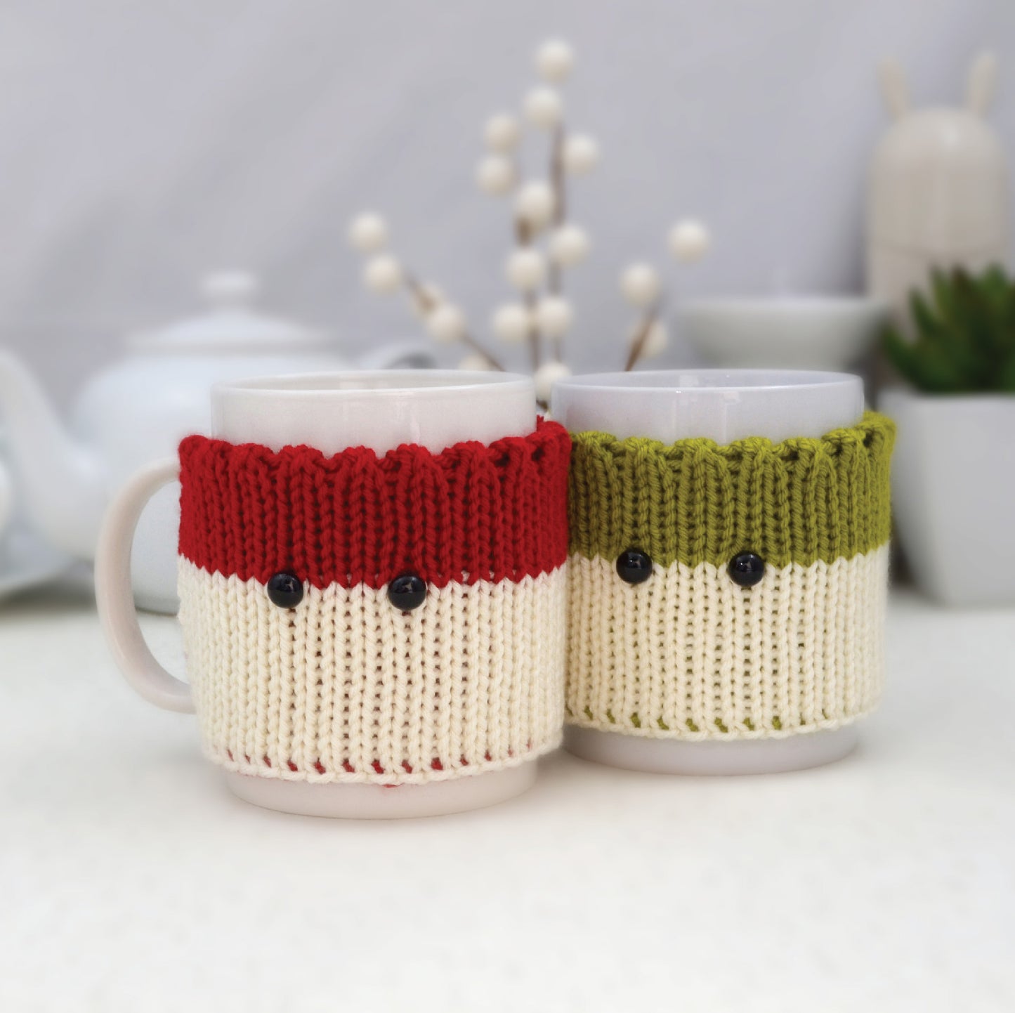 Knitted Mug Cozies with black eyes, Set of 2. Christmas gift.