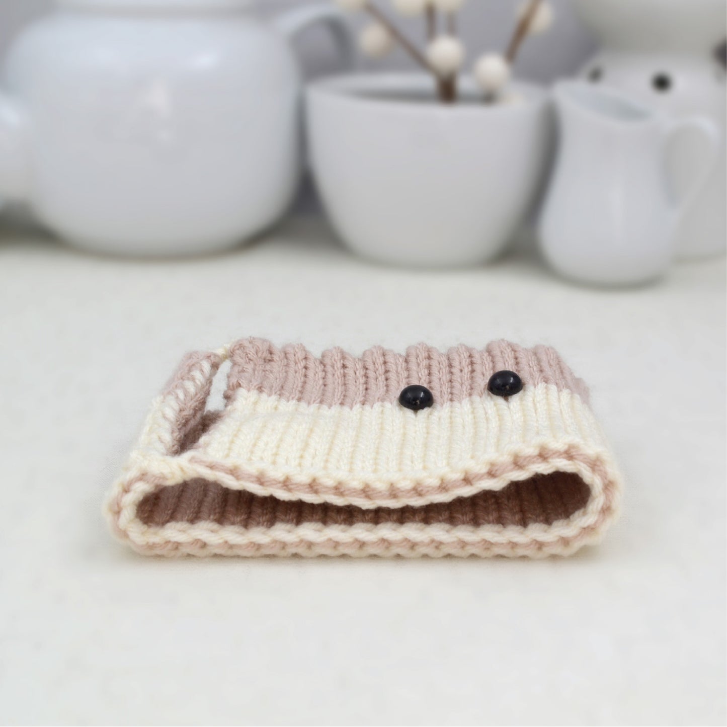 Knitted Mug Cozy with black eyes