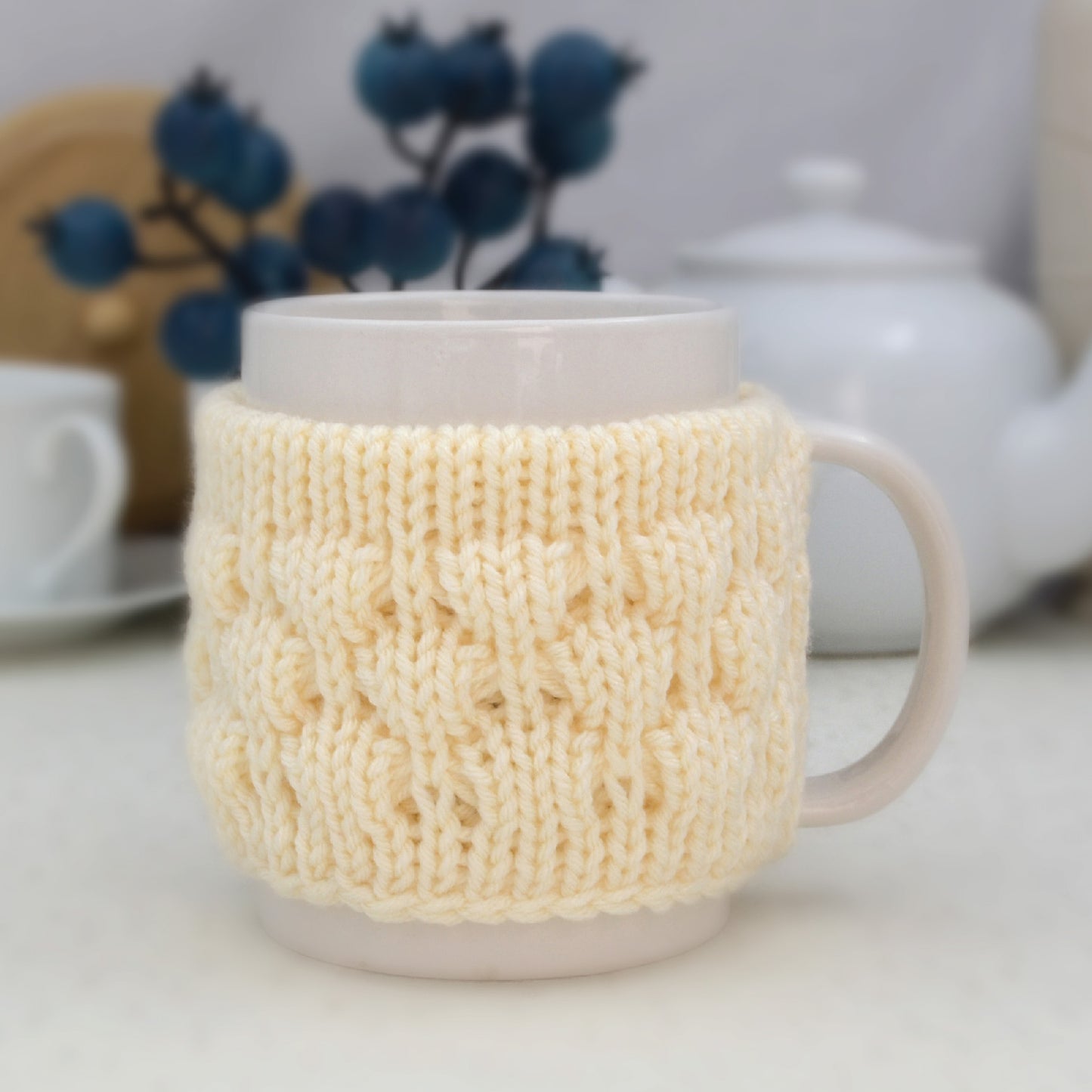 Knitted mug cozy.