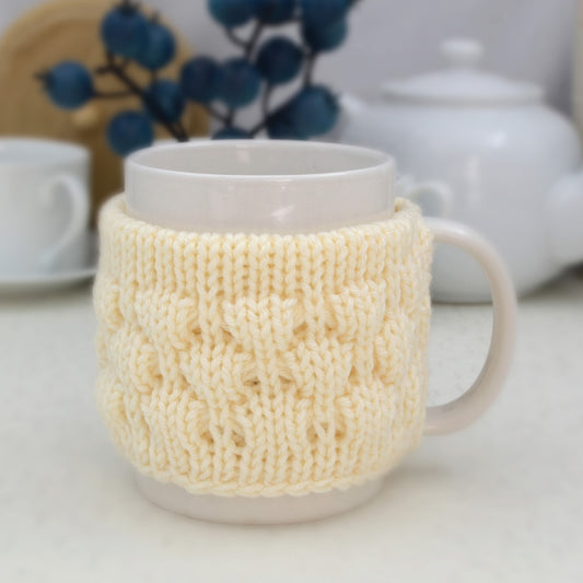 Knitted mug cozy.