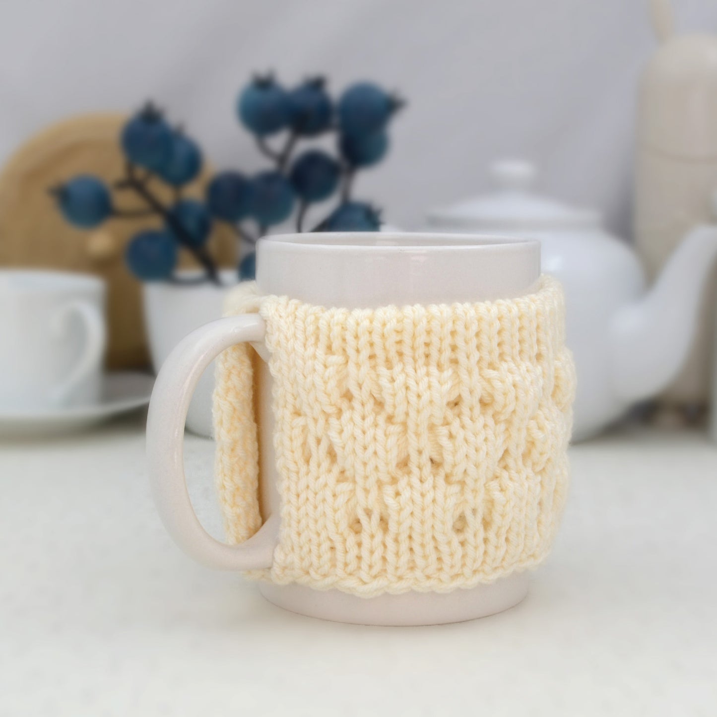 Knitted mug cozy.