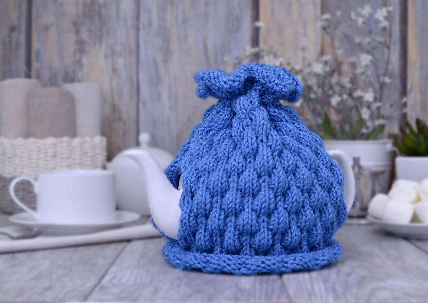 Blue knitted teapot cozy