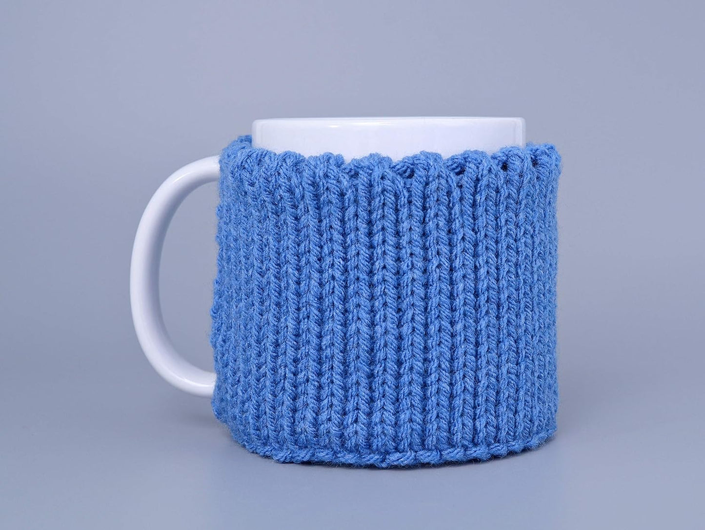 Blue knitted mug cozy