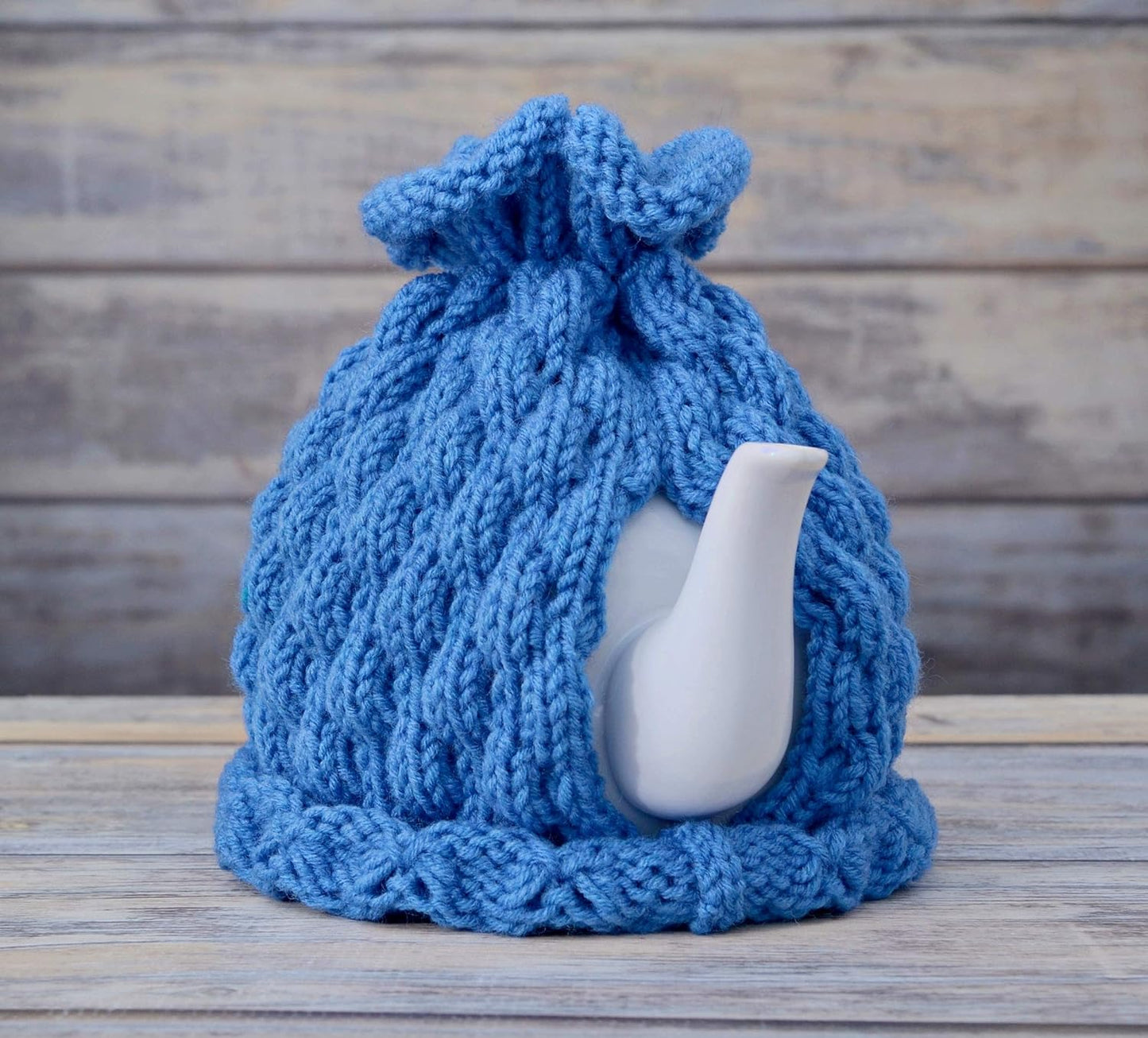 Blue knitted teapot cozy