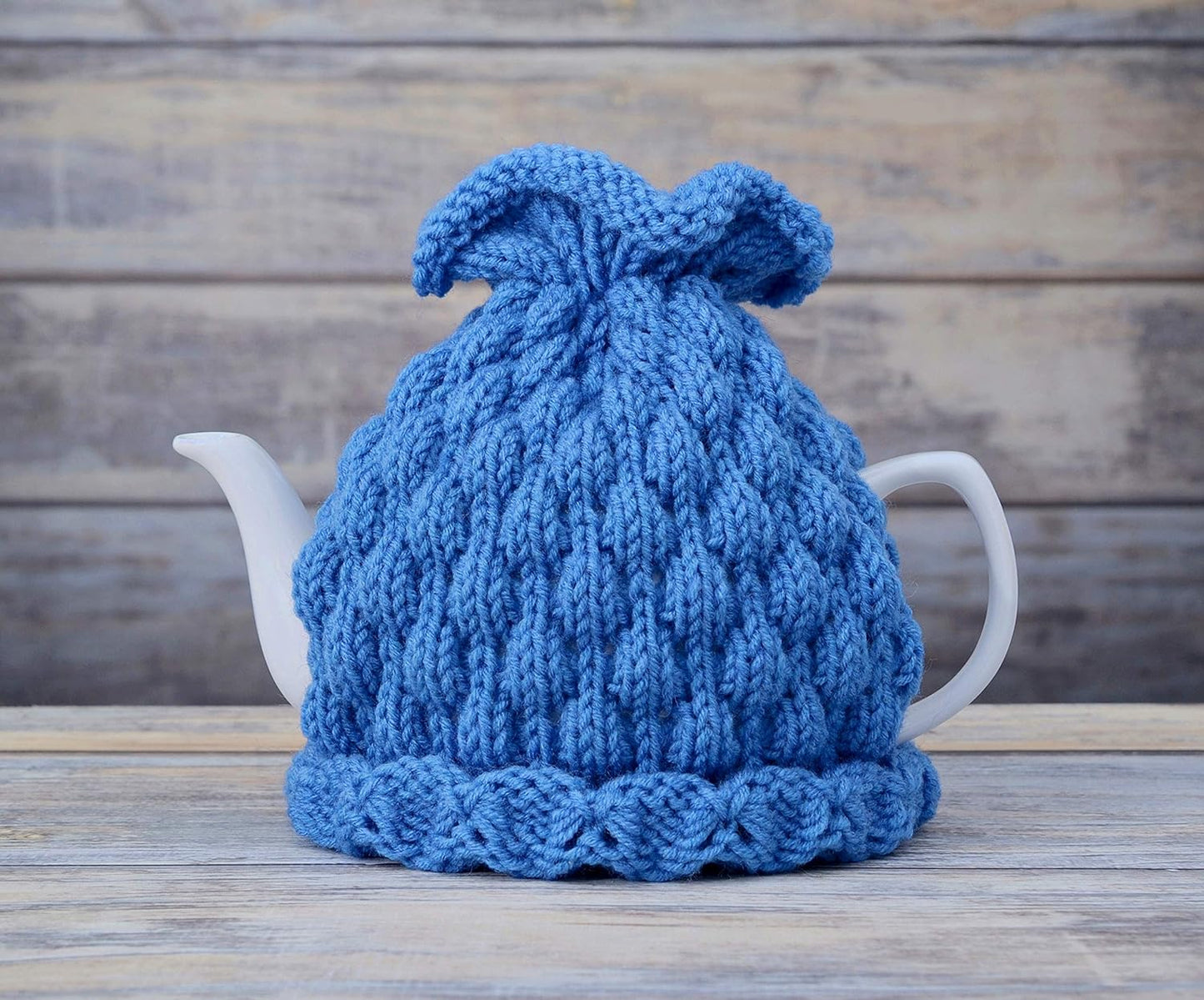 Blue knitted teapot cozy