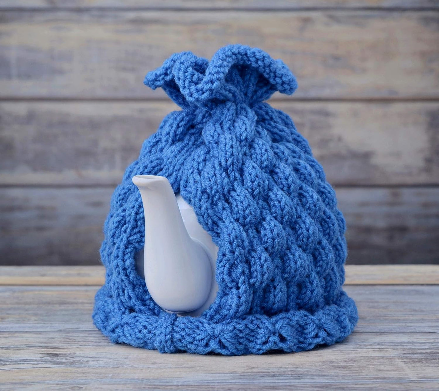 Blue knitted teapot cozy