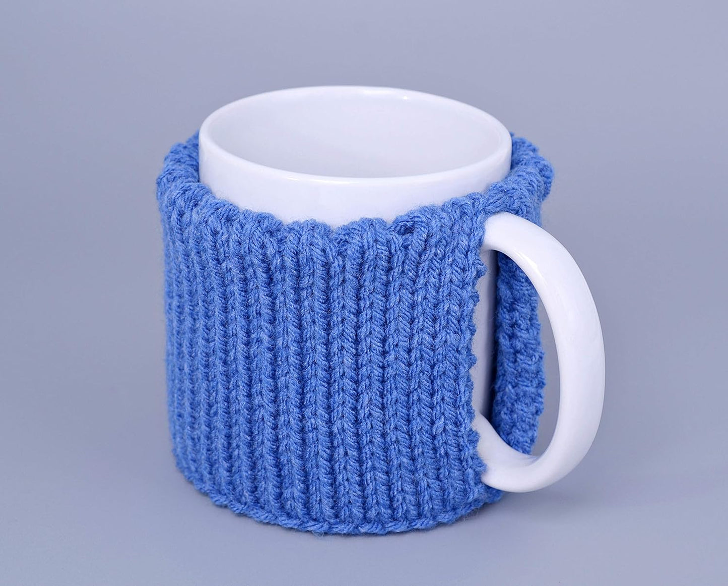 Blue knitted mug cozy