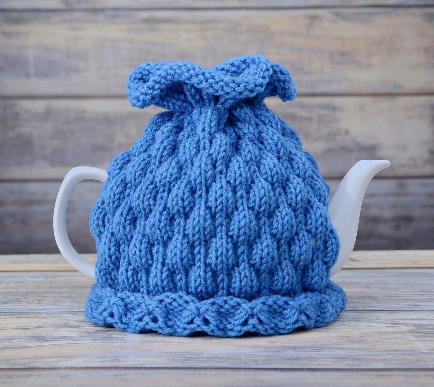 Blue knitted teapot cozy