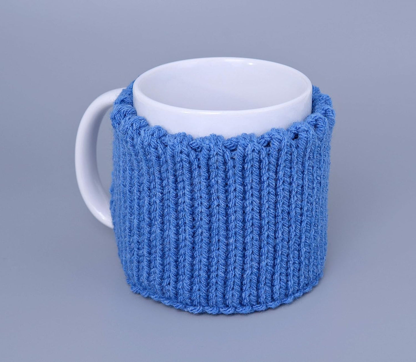 Blue knitted mug cozy