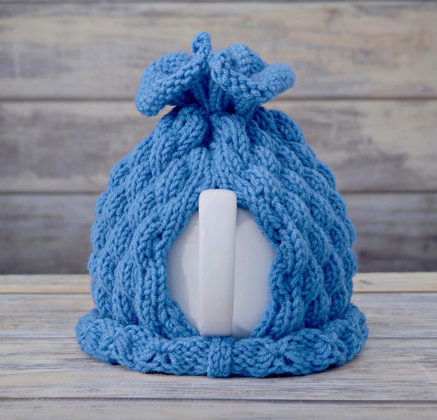 Blue knitted teapot cozy