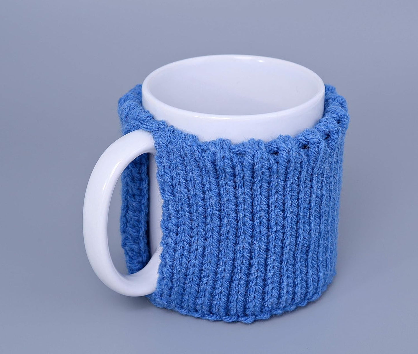 Blue knitted mug cozy