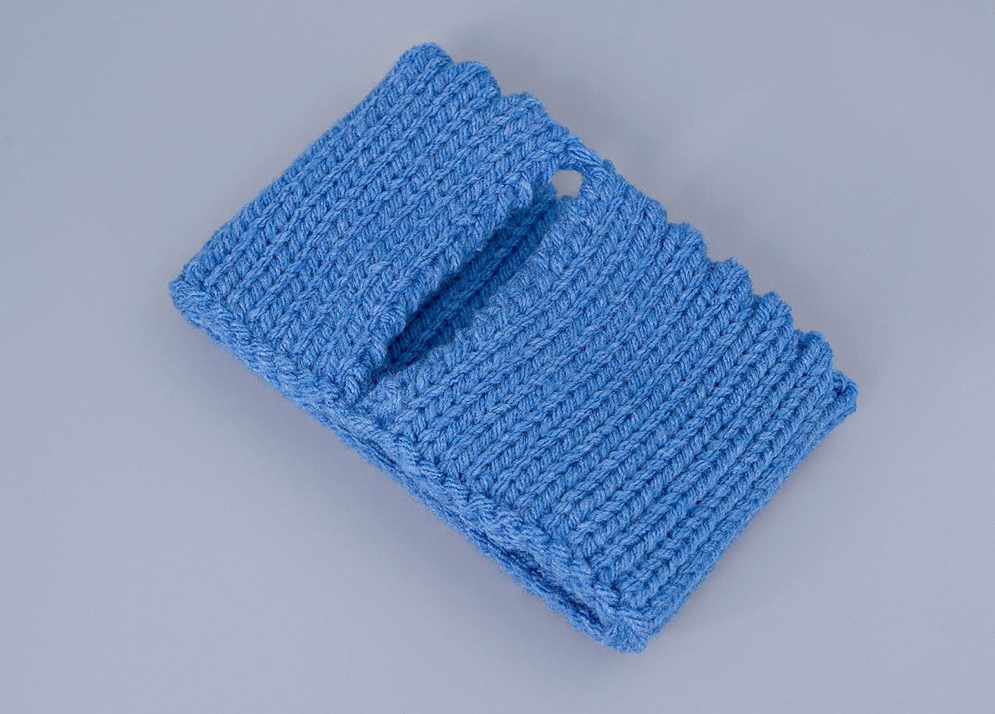 Blue knitted mug cozy