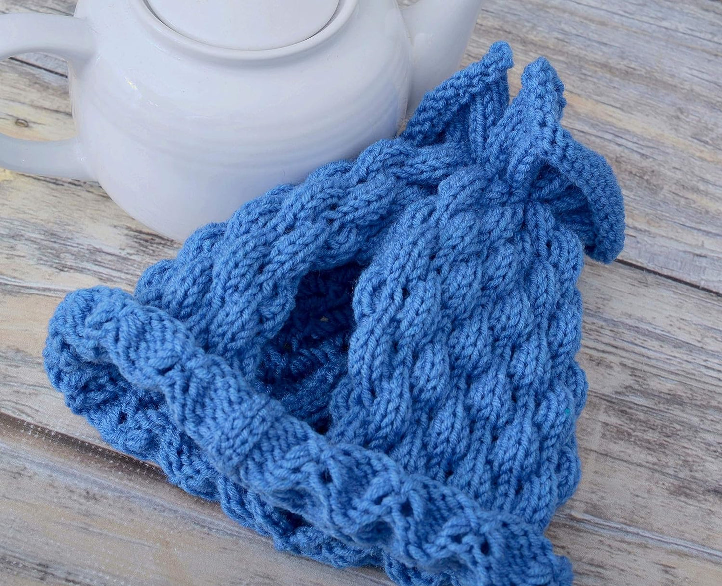 Blue knitted teapot cozy