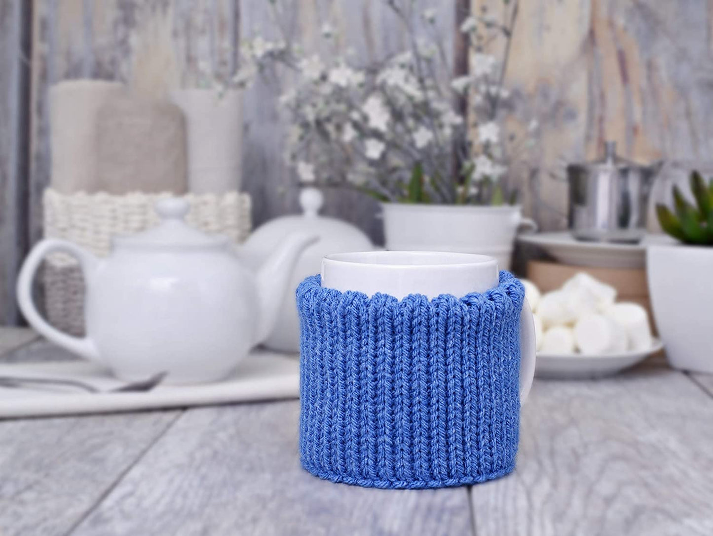 Blue knitted mug cozy