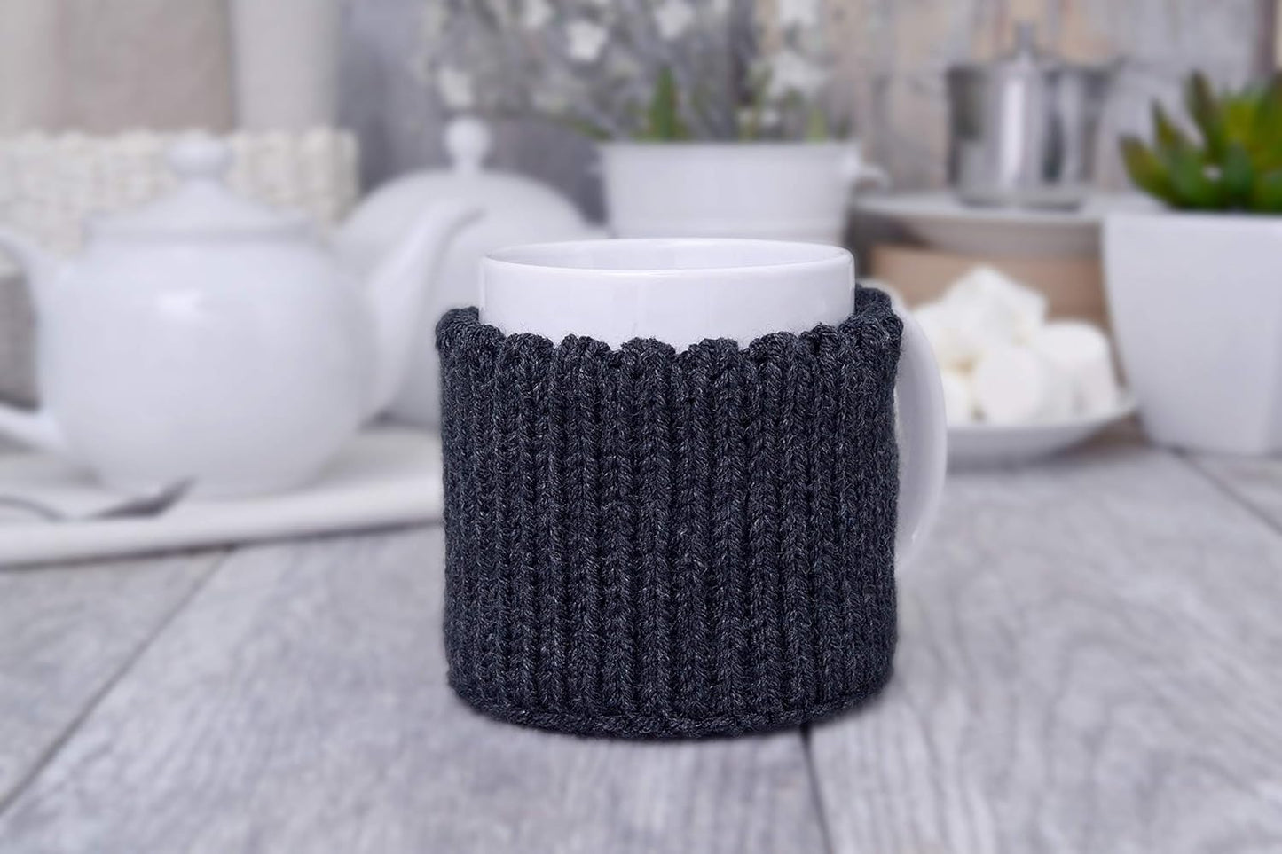 Dark gray knitted mug cozy