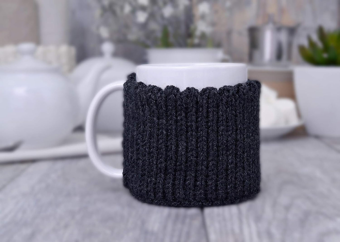 Dark gray knitted mug cozy