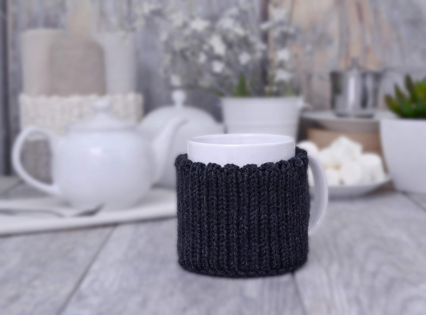 Dark gray knitted mug cozy