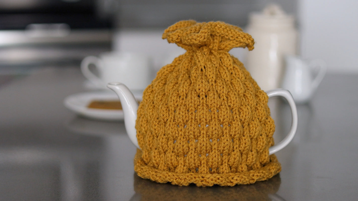 Mustard knitted teapot cozy