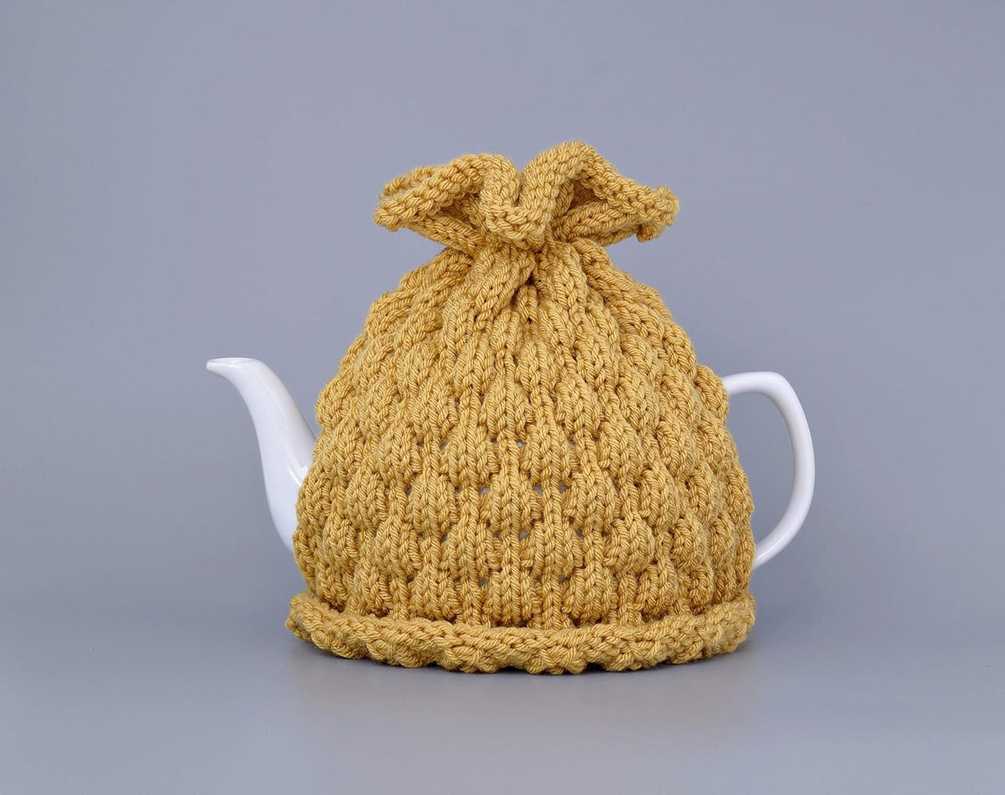 Mustard knitted teapot cozy