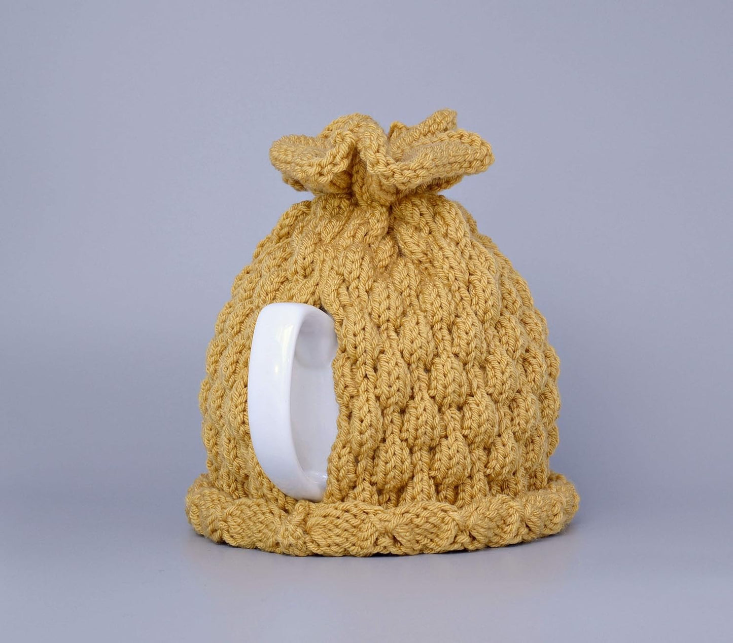 Mustard knitted teapot cozy