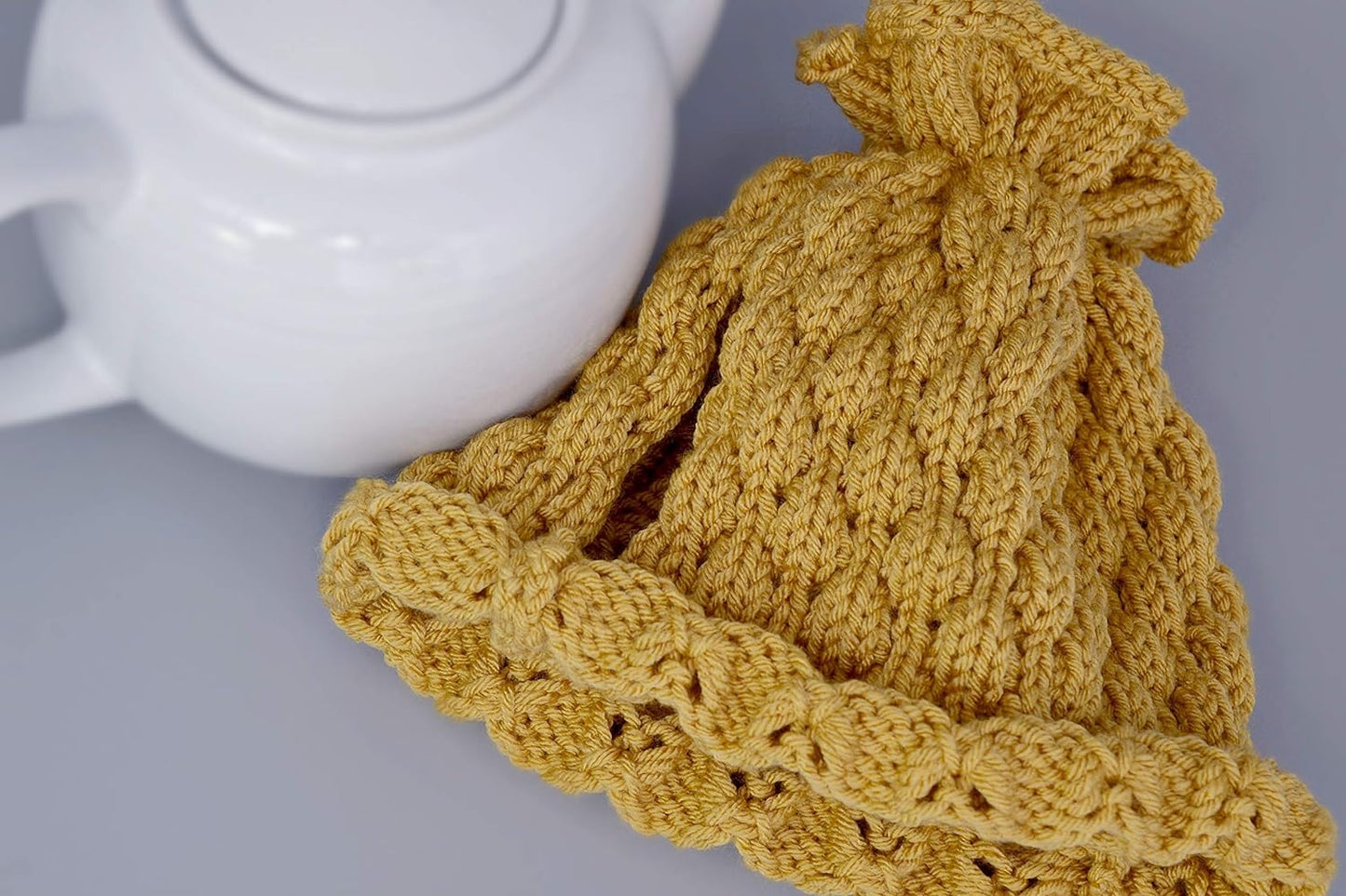 Mustard knitted teapot cozy