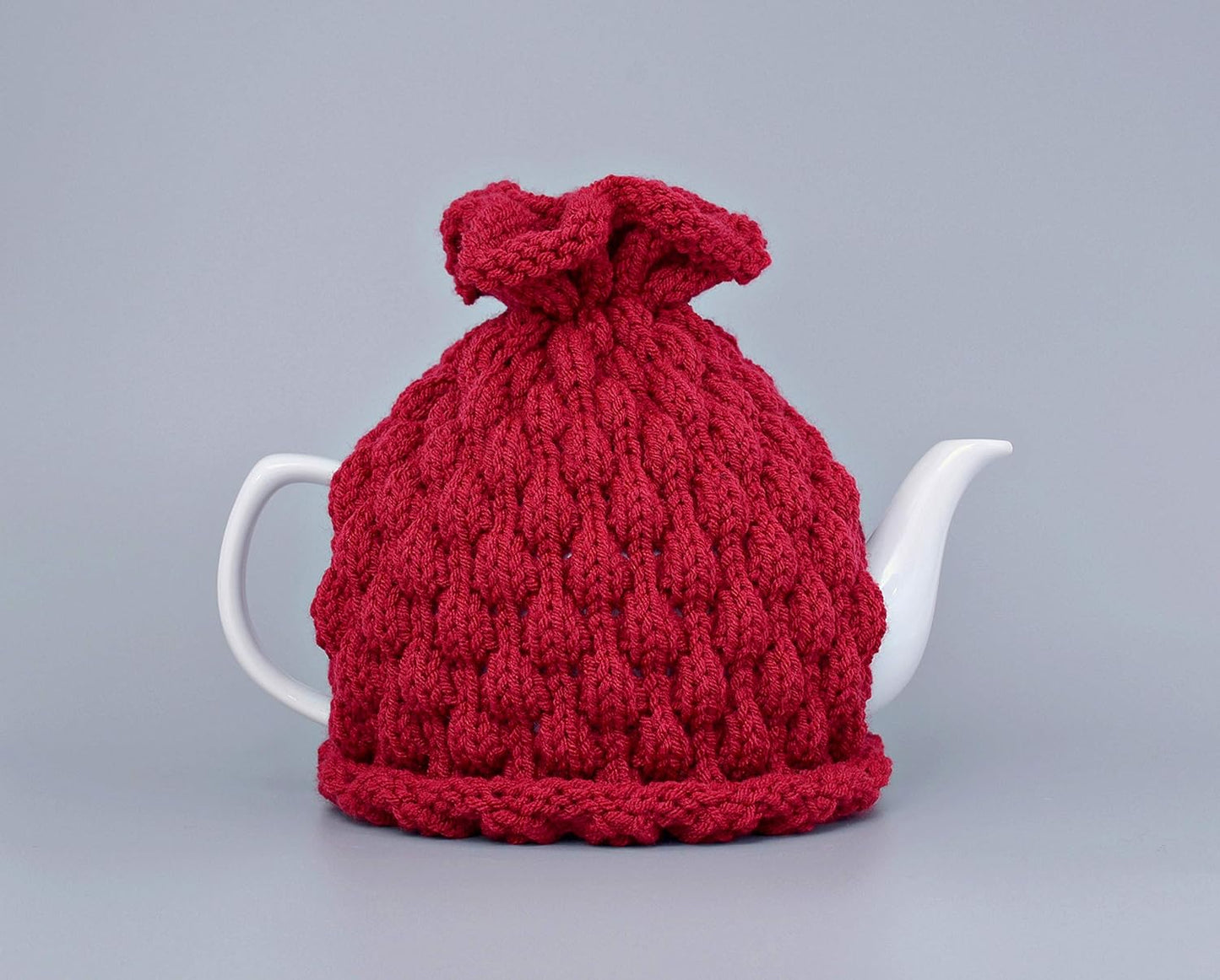 Red knitted teapot cozy