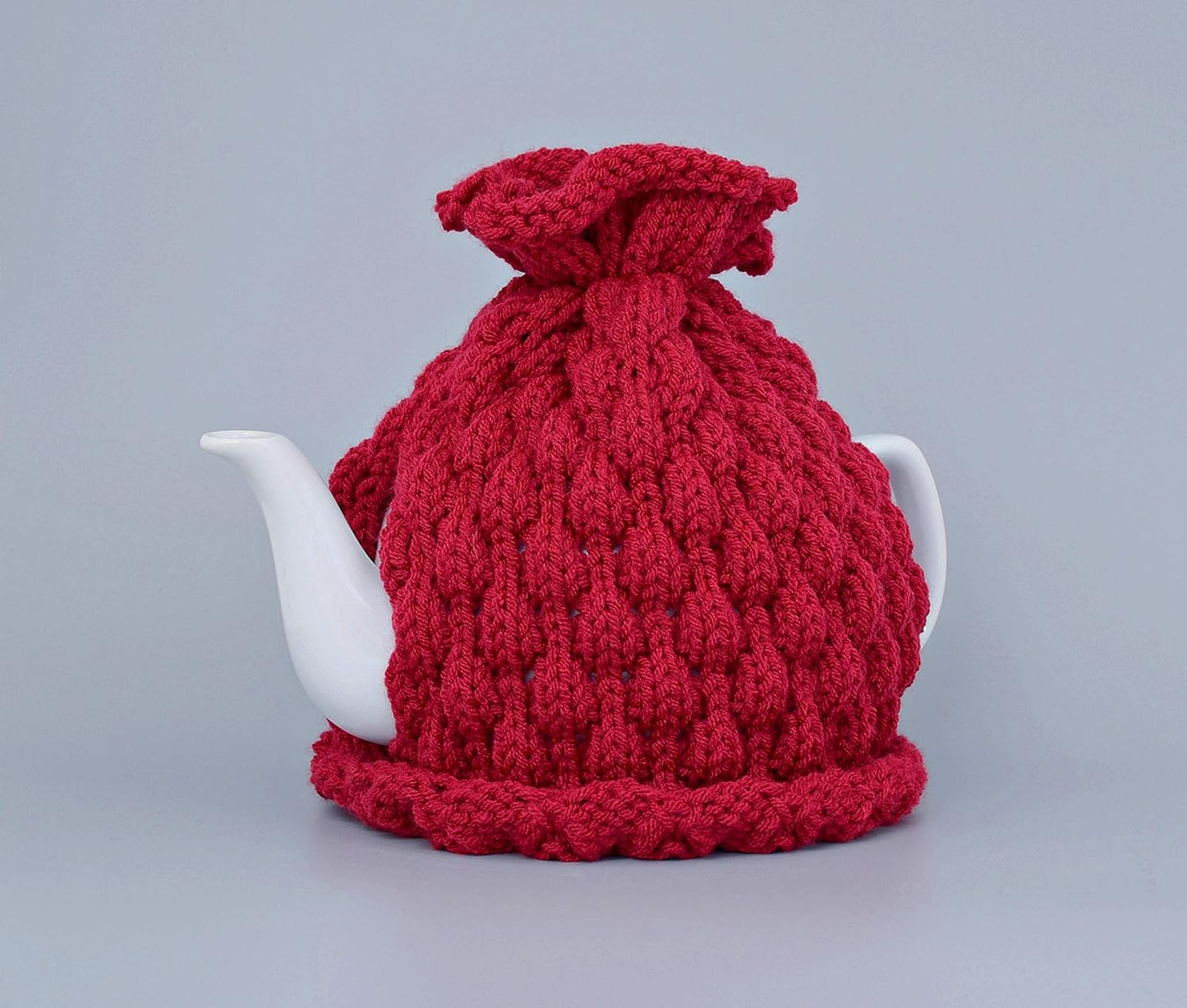 Red knitted teapot cozy