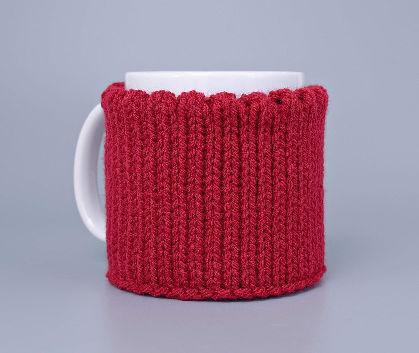 Red knitted mug cozy