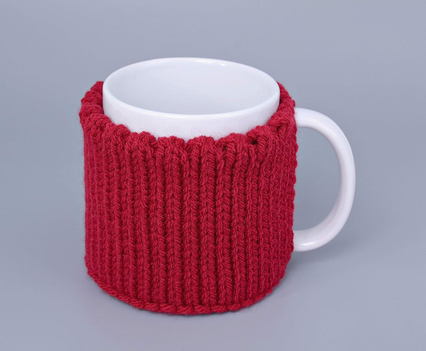 Red knitted mug cozy