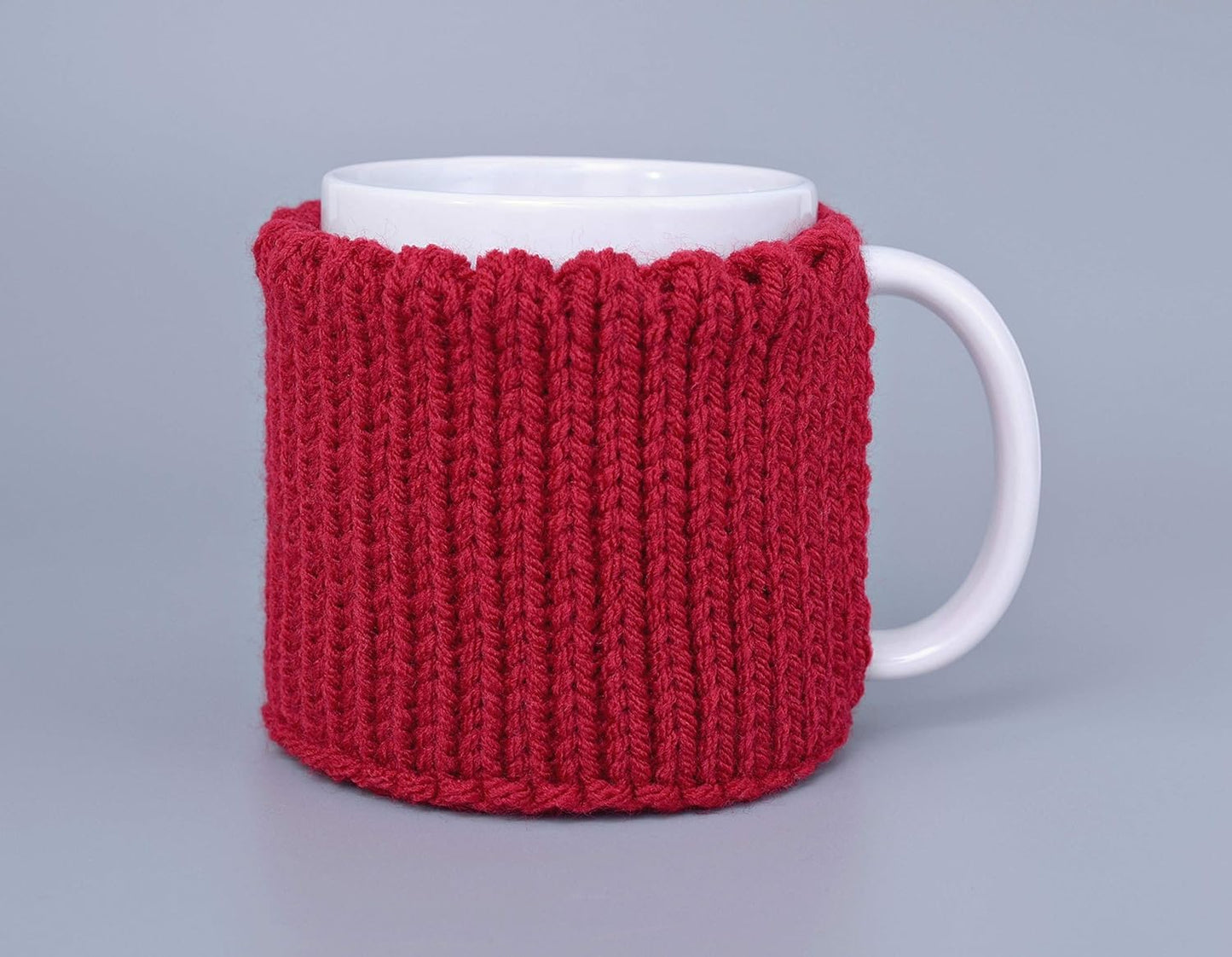 Red knitted mug cozy