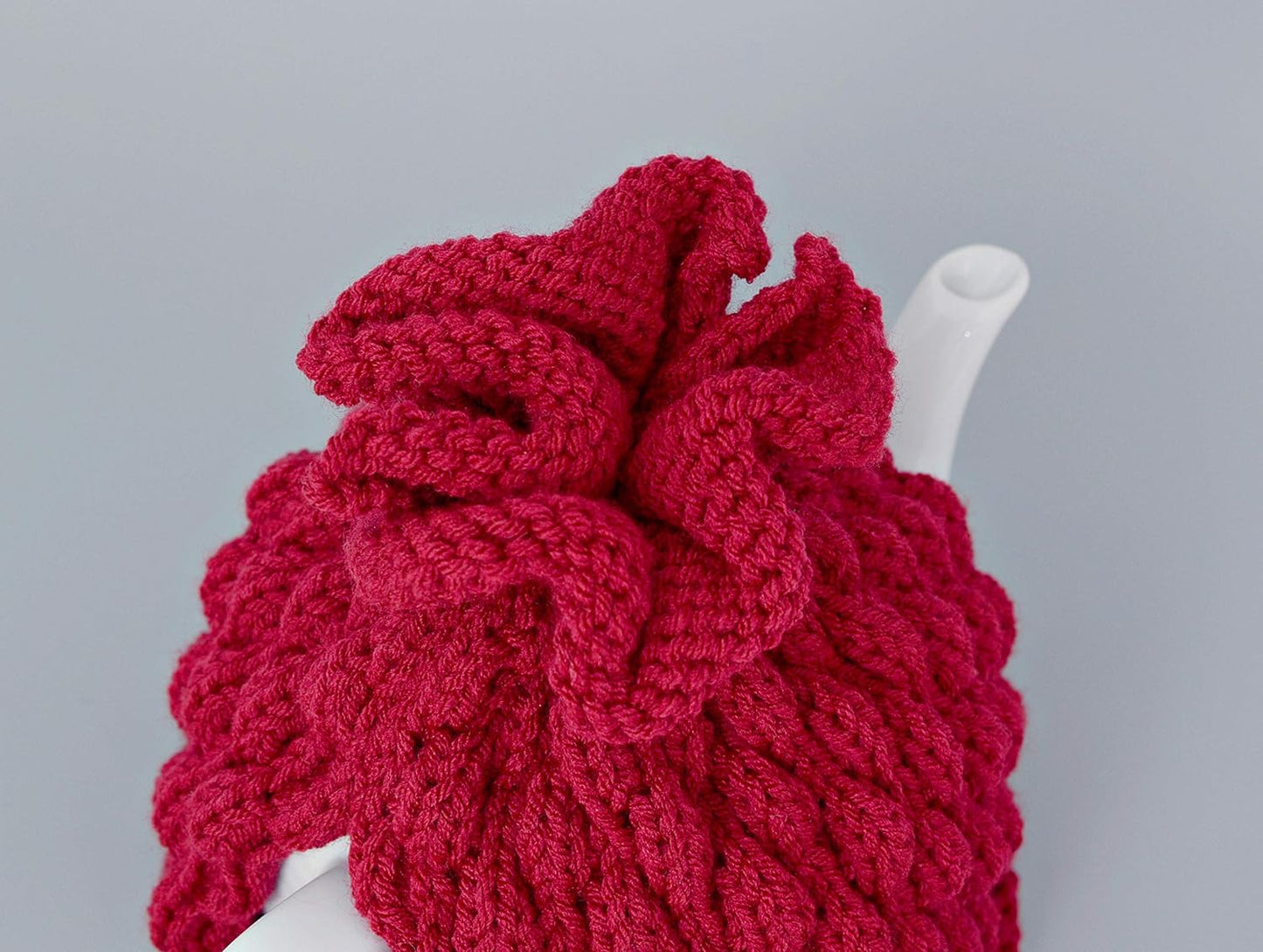 Red knitted teapot cozy