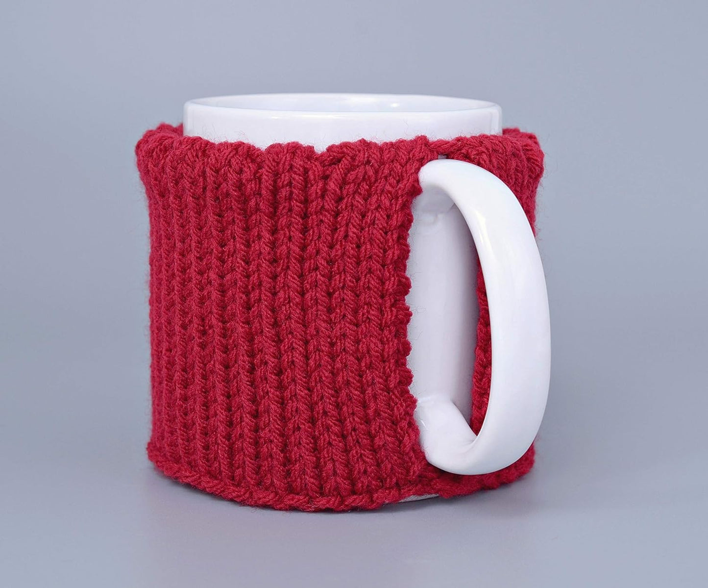 Red knitted mug cozy